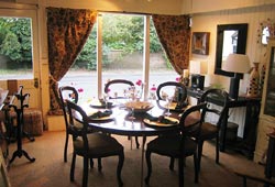Photo of Dark Wooden Table, Chairs and Curtains Photo of Dark Wooden Table, Chairs and Curtains